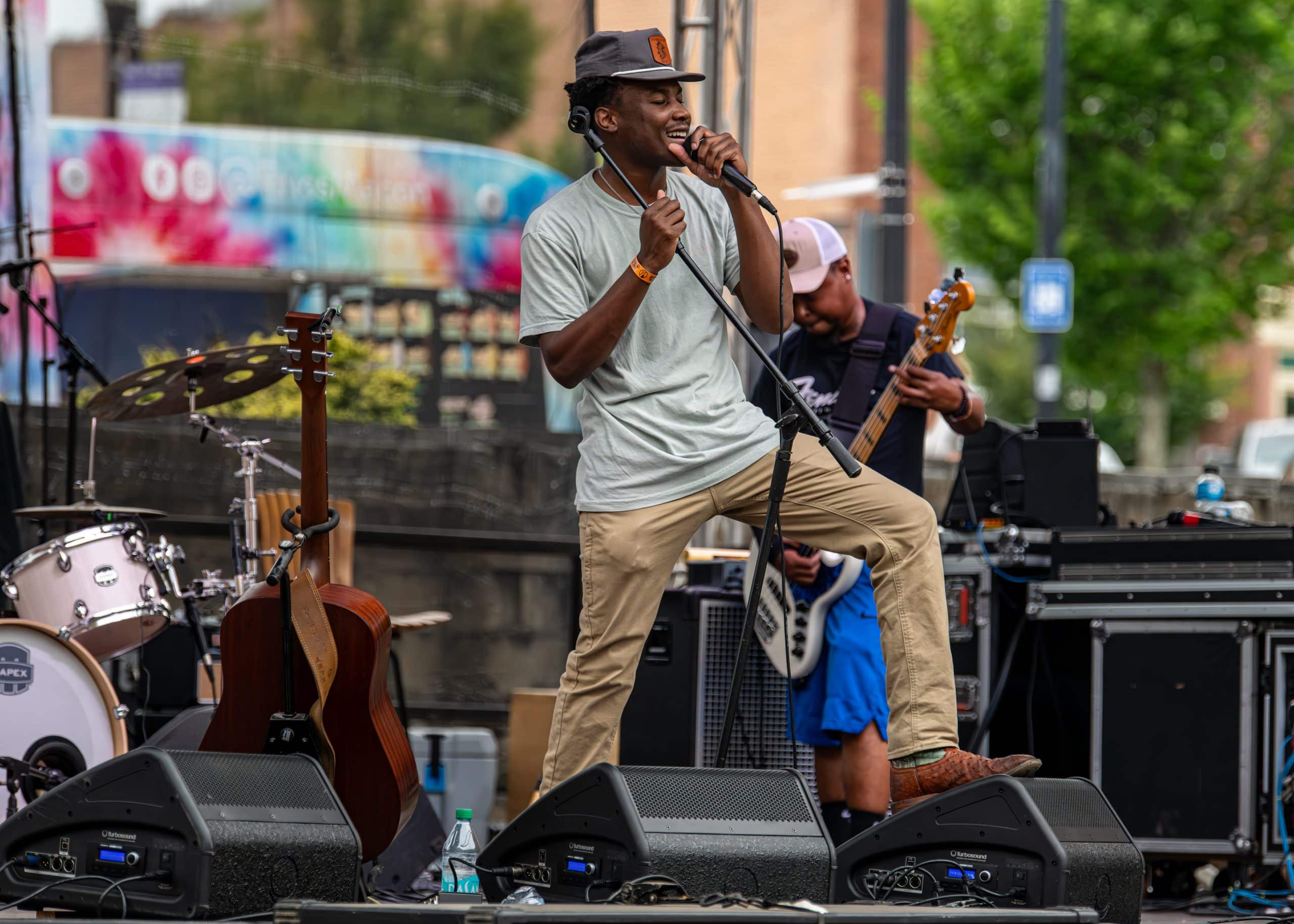 A band performs a concert on stage in front of fans